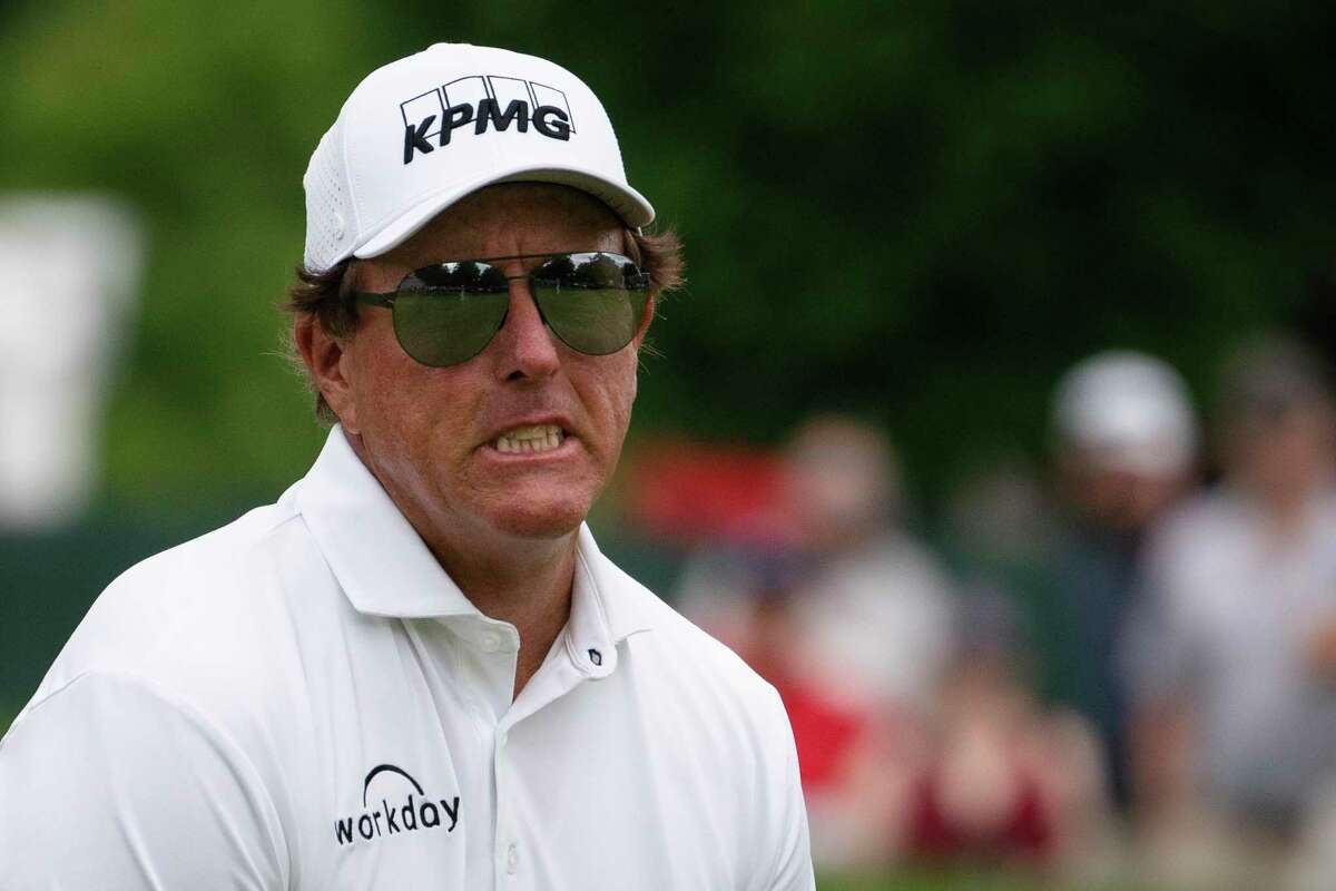 Phil Mickelson reacts after missing a putt on the ninth green during the final round of the Travelers Championship golf tournament at TPC River Highlands, Sunday, June 27, 2021, in Cromwell, Conn. (AP Photo/John Minchillo)