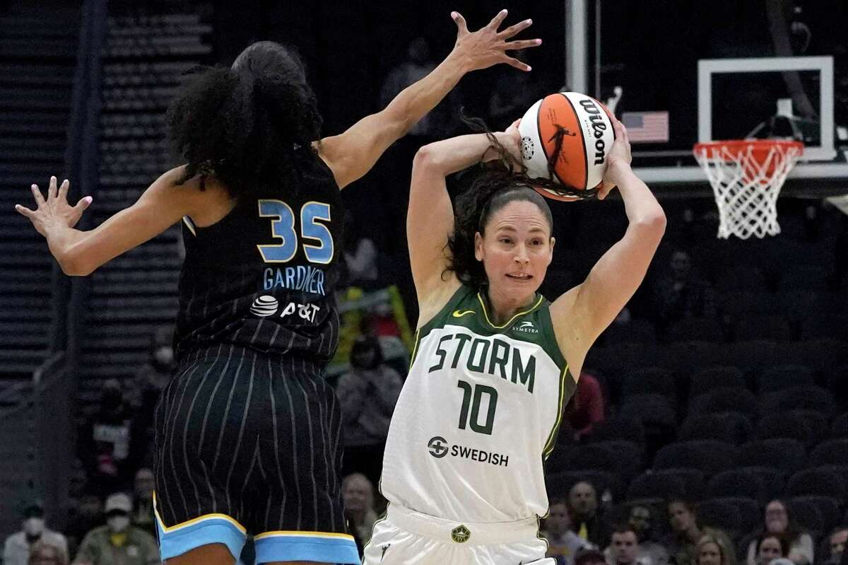Seattle Storm guard Sue Bird passes around the defense of Chicago Sky guard Rebekah Gardner during the second half on May 18 in Seattle.