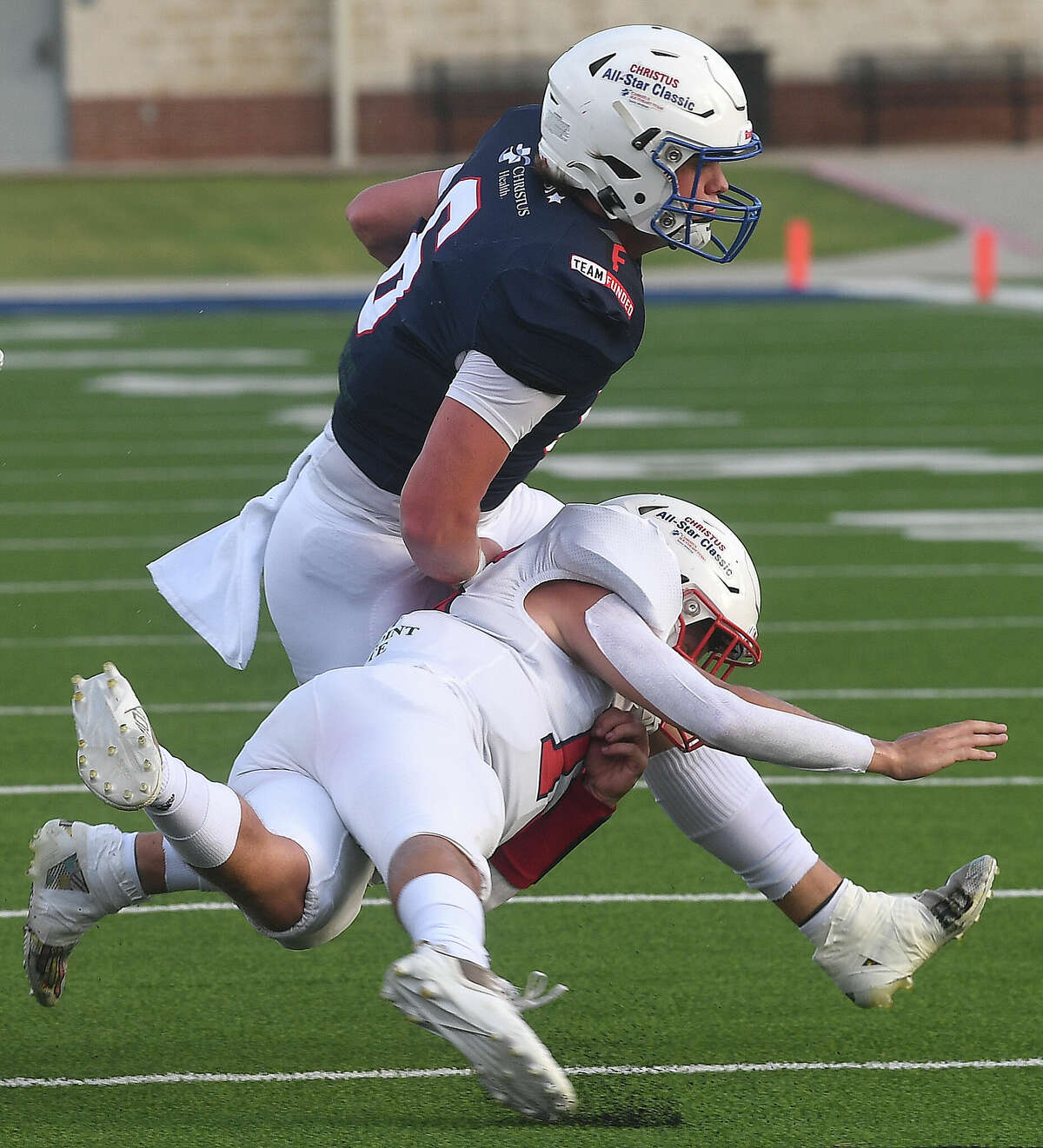 Teams East and West compete during the Christus All-Star Classic football game at Beaumont Memorial Stadium. Photo made Friday, June 17, 2022. Kim Brent/The Enterprise