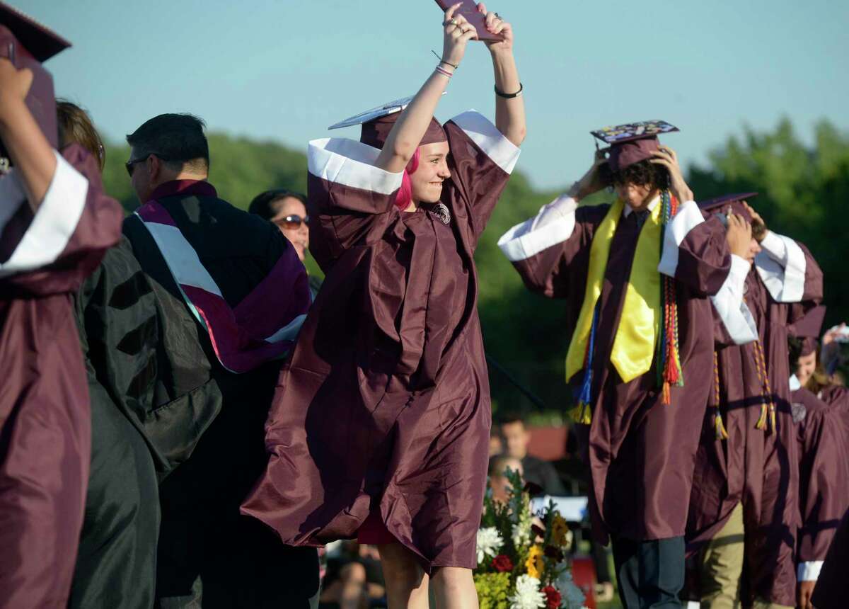 Jaidyn Elizabeth Ann Howley celebrates by showing off her diploma during the 2022 Bethel High School Graduation, Friday, June 17, 2022, Bethel, Conn.