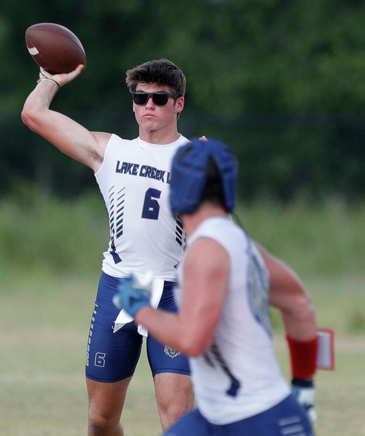 Lake Creek quarterback Eli Morcos throws a pass during a high school state 7on-7 tournament at Grand Oak High School, Friday, June 17, 2022, in Spring.