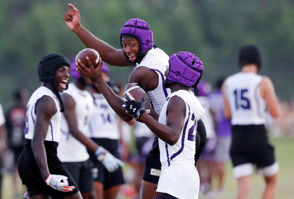 Willis’ quarterback DJ Lagway, left, celebrates after Jacorion Hatchett broke up a pass during a high school state 7on-7 tournament at Grand Oak High School, Friday, June 17, 2022, in Spring.