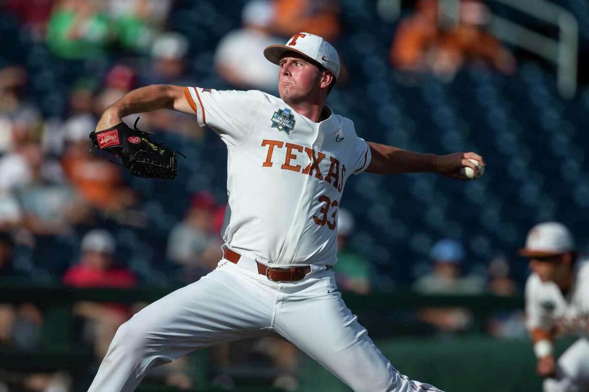 Texas starting pitcher Pete Hansen throws to a Notre Dame batter during the first inning of an NCAA College World Series baseball game Friday, June 17, 2022, in Omaha, Neb. (AP Photo/John Peterson)