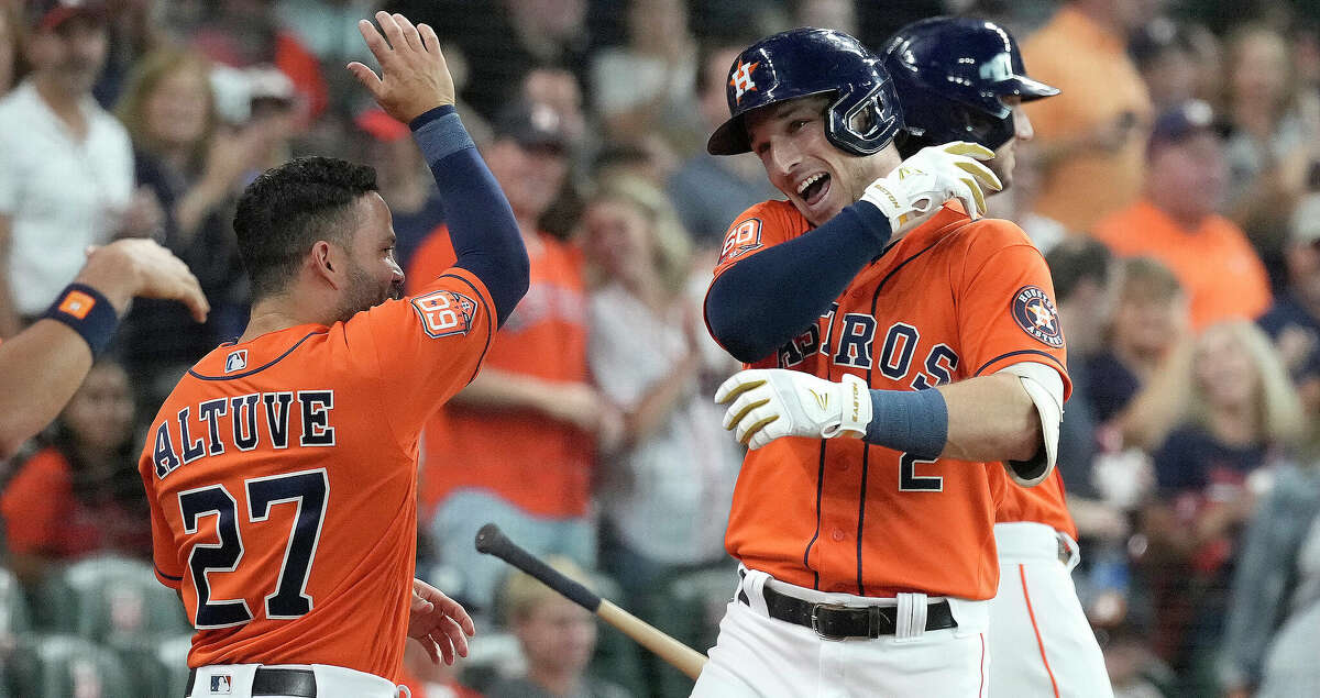 Houston Astros' Alex Bregman (2) celebrates with Jose Altuve after hitting a two-run home run off of Chicago White Sox starting pitcher Lucas Giolito during the first inning of an MLB game at Minute Maid Park on Friday, June 17, 2022 in Houston.
