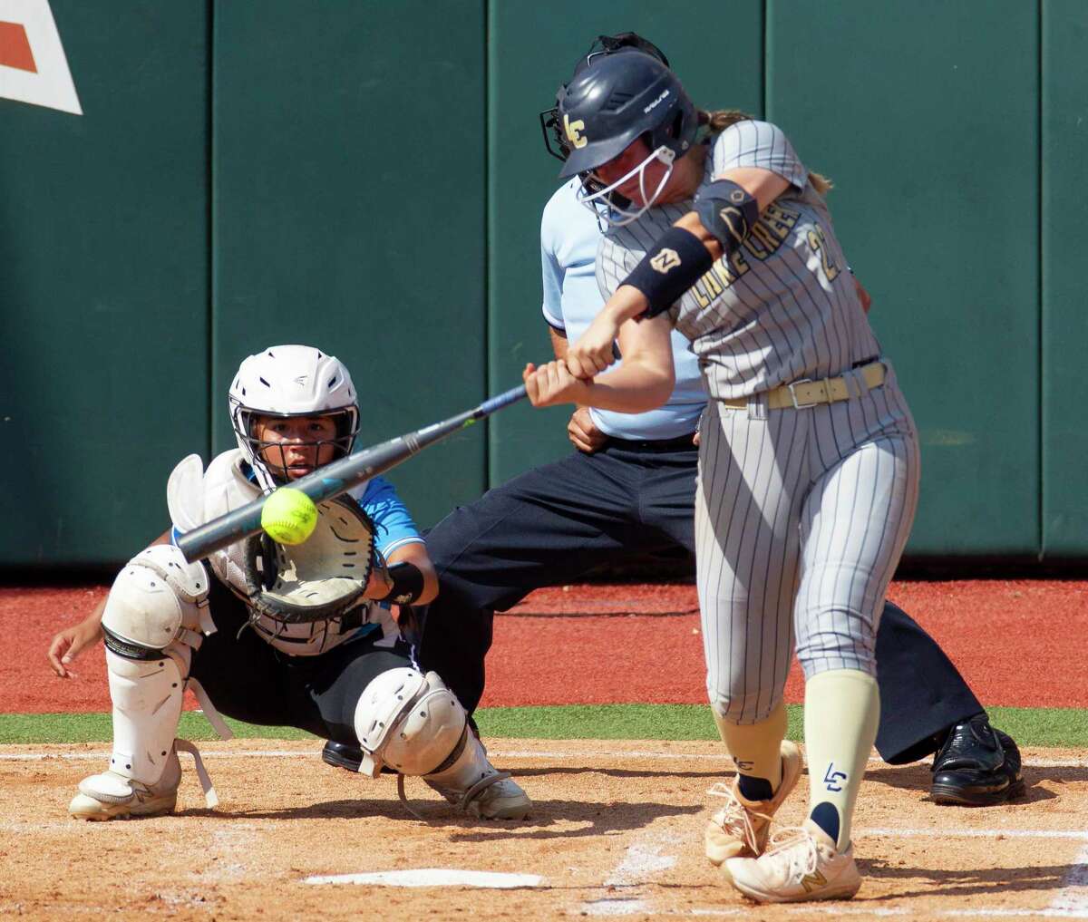 Ava Brown #22 of Lake Creek hits a double in the third inning of their Class 5A semifinal game during the UIL State Softball Championships at Red & Charline McCombs Field, Friday, June 3, 2022, Austin.