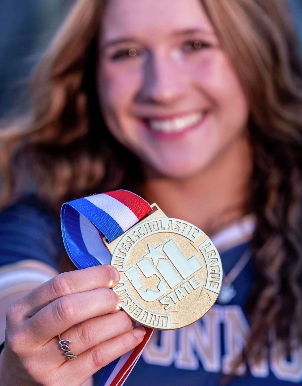 Express-News All-Area softball player of the Year Leighann Goode of O'Connor poses Wednesday, June 15, 2022 at O’Connor with her state championship medal.
