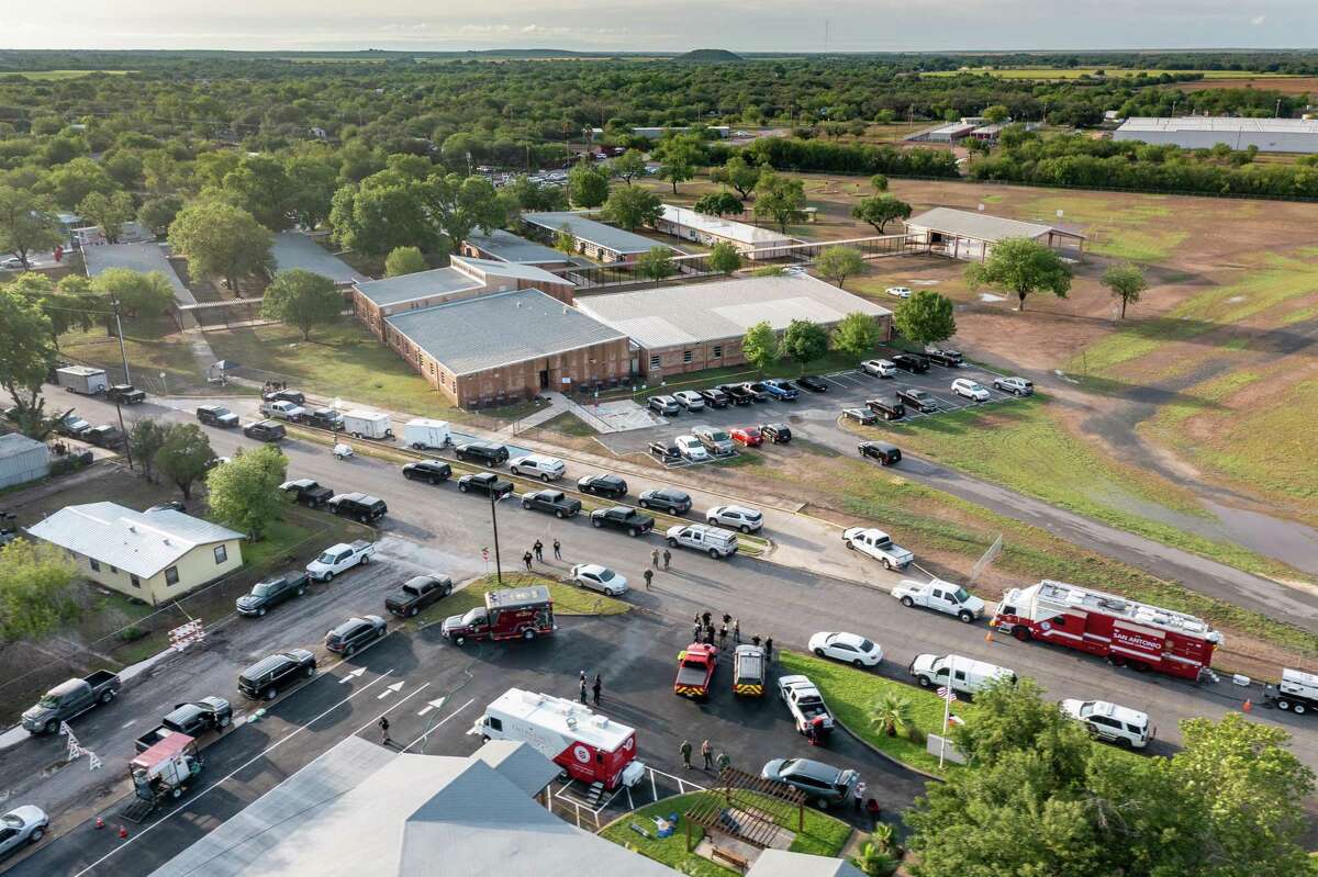 UVALDE, TX - MAY 25: In this aerial view, law enforcement works on scene at Robb Elementary School where at least 21 people were killed yesterday, including 19 children, on May 25, 2022 in Uvalde, Texas. The shooter, identified as 18 year old Salvador Ramos, was reportedly killed by law enforcement. (Photo by Jordan Vonderhaar/Getty Images) *** BESTPIX ***