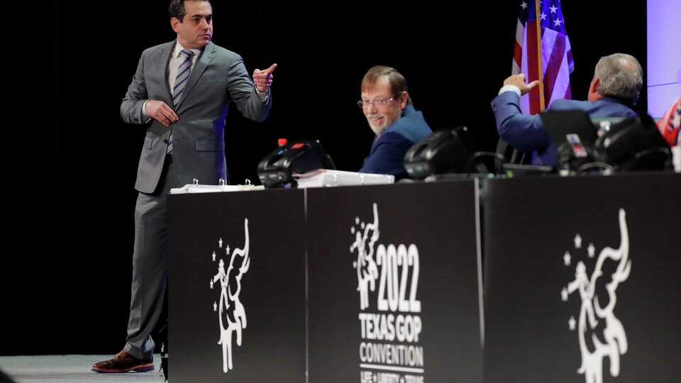 Matt Rinaldi, left, chairman of the Republican Party of Texas, asks questions of the parlimentarian and rules officials during the third and final day of this year's Republican Party of Texas Convention Saturday, June 18, 2022, held at the George R. Brown Convention Center in Houston, TX.