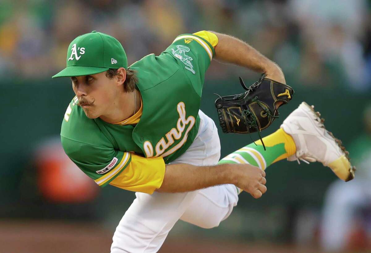 Oakland Athletics pitcher Daniel Mengden works against the Seattle Mariners during the first inning of a baseball game Tuesday, July 16, 2019, in Oakland, Calif. (AP Photo/Ben Margot)