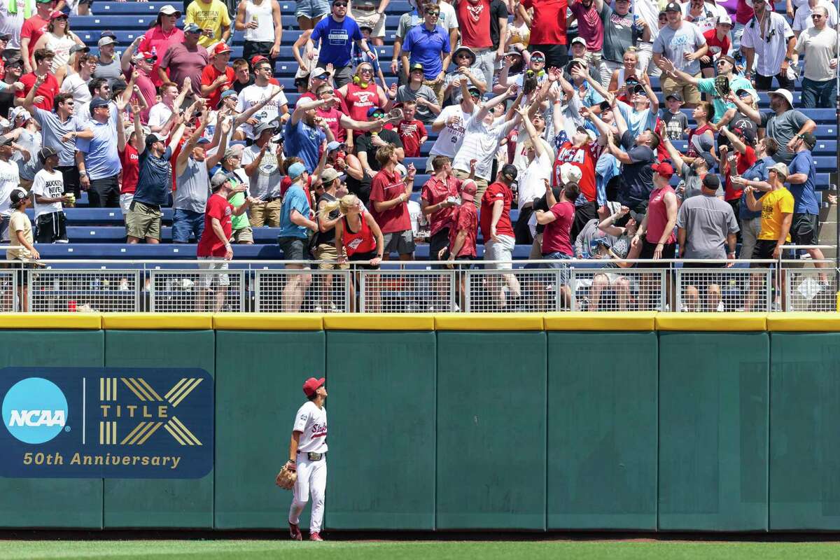Stanford left fielder Eddie Park (22) watches the ball go over the railing for an Arkansas home run in the fifth inning during an NCAA College World Series baseball game Saturday, June 18, 2022, in Omaha, Neb. (AP Photo/John Peterson)