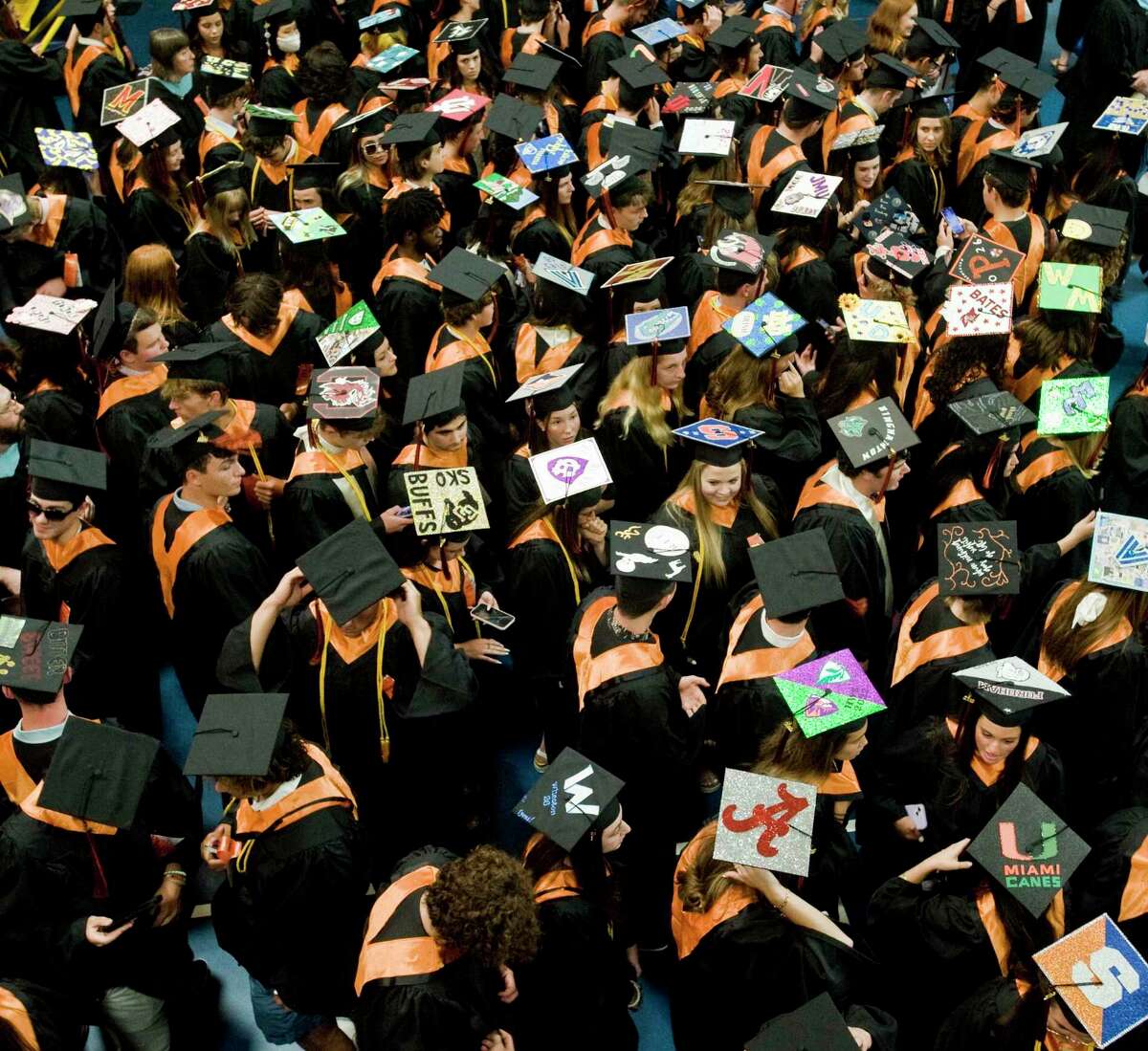 Students await the commencement of the Ridgefield High School graduation at the O'Neill Center. Friday, June 17, 2022