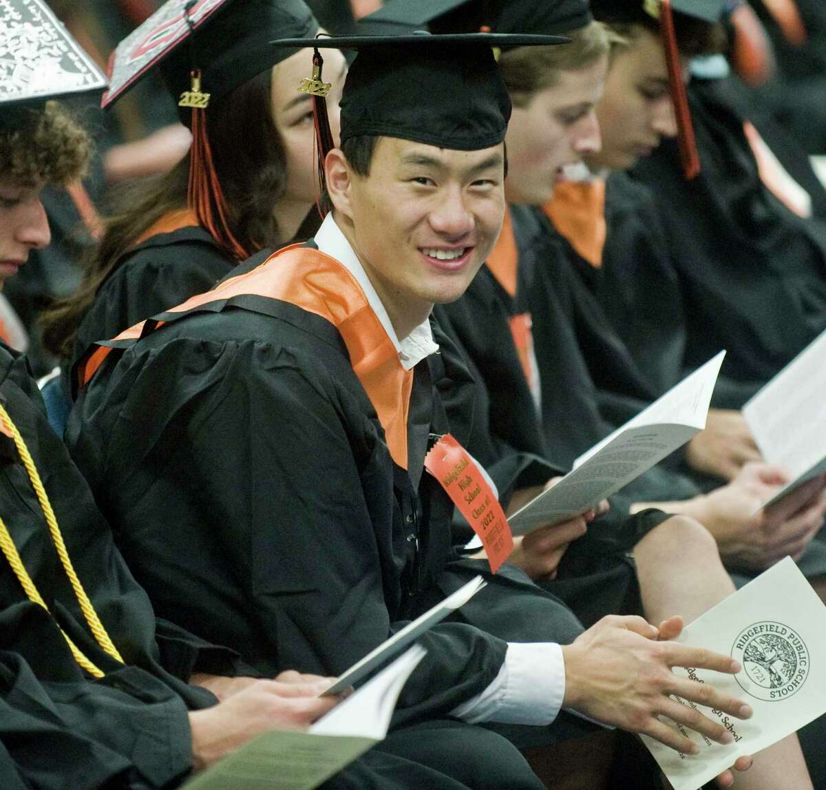 Terry Li enjoying the speakers at the Ridgefield High School graduation held at the O'Neill Center. Friday, June 17, 2022