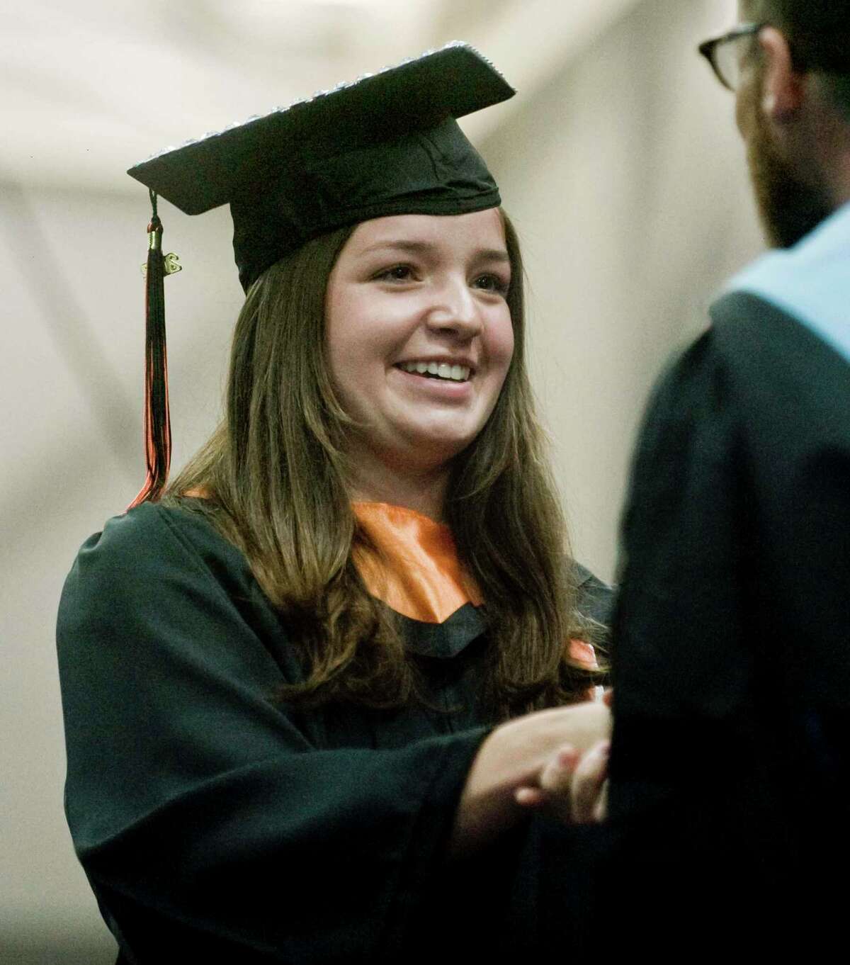 Shannon Austin receiving her diploma at the Ridgefield High School graduation held at the O'Neill Center. Friday, June 17, 2022