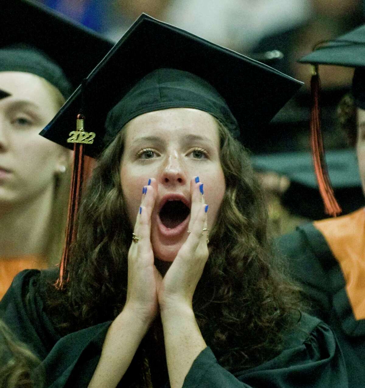 Riley Riebling cheering a classmate at the Ridgefield High School graduation held at the O'Neill Center. Friday, June 17, 2022