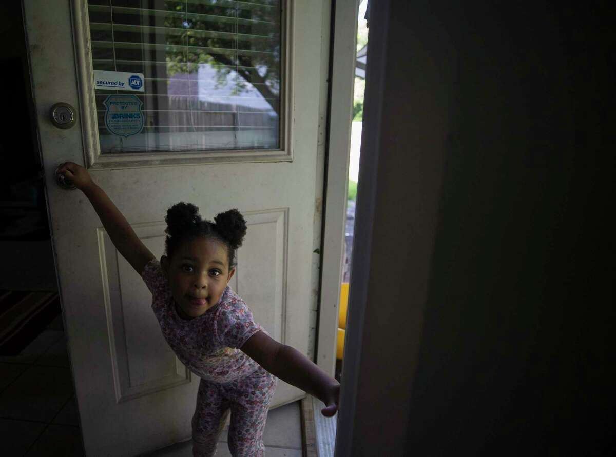 Ehlani Williams closes the door behind her as she joins the rest of her family in the backyard on Sunday, May 15, 2022 in Spring.