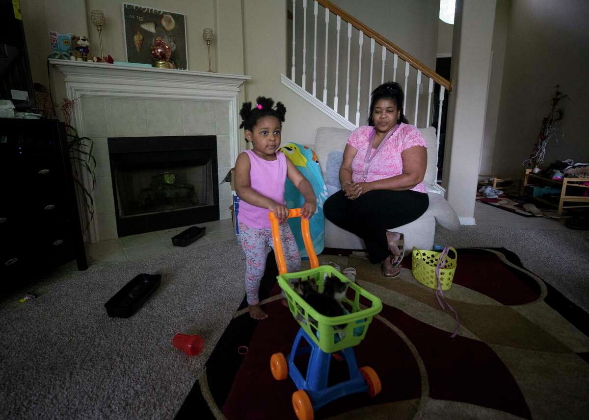 Ehlani Williams, 3, plays with a toy cart while inside the family's home on Thursday, April 28, 2022 in Spring.