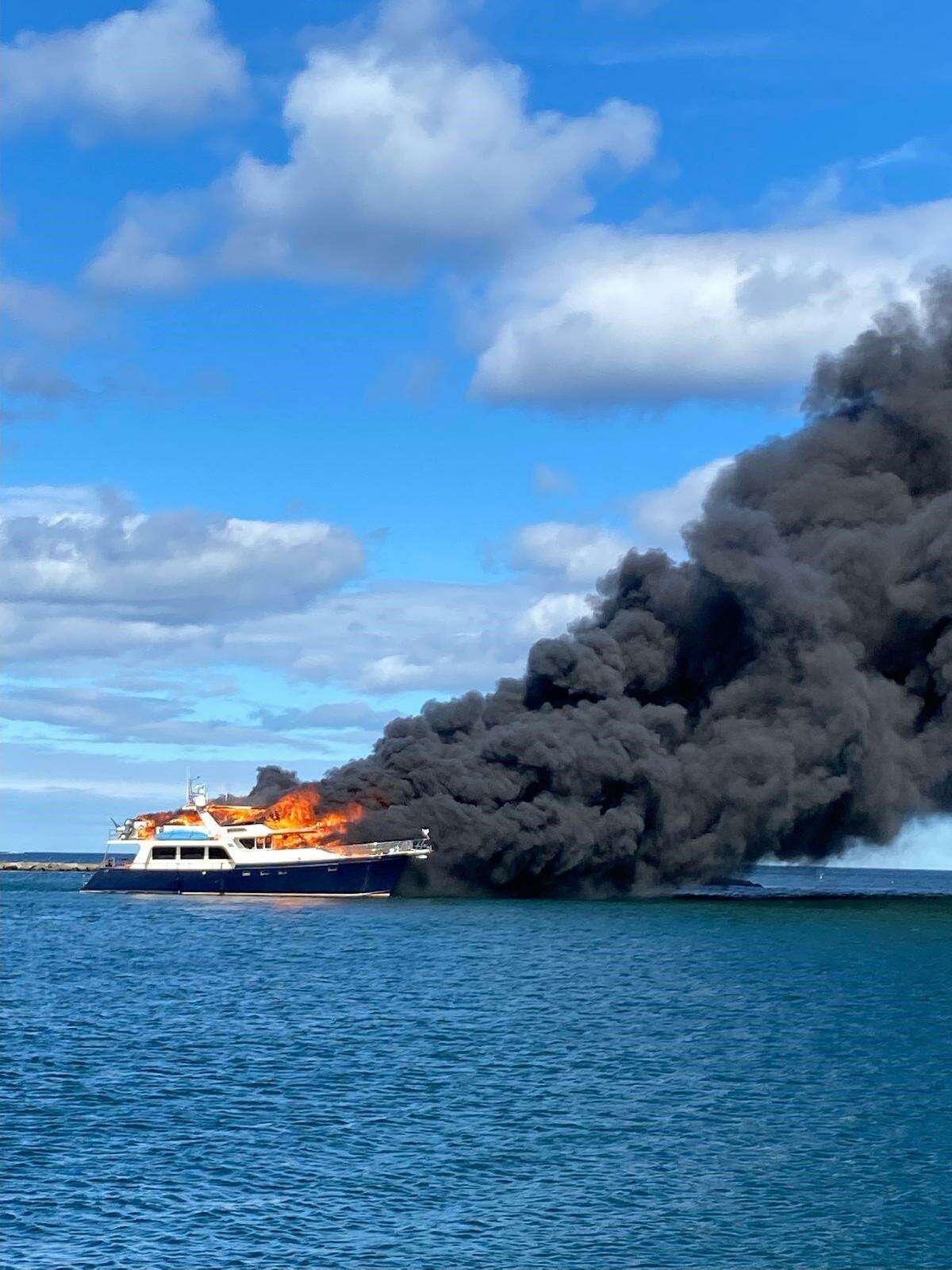 The U.S. Coast Guard posted this photo of a 70-foot-yach, the Elusive, after it caught fire on June 18 in New Hampshire.