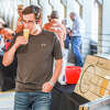 Jeremy Simpson enjoys a craft beer from Oracle Brewing during the Tapped Downtown Midland Craft Beer Festival which took palce in the Larkin Parking Garage on June 18, 2022 in Midland.