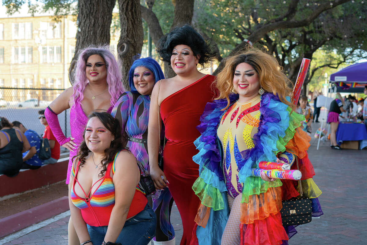 Members of the Laredo Drag Haus pose with people at the Gateway City Pride Parade & Festival on June 18.