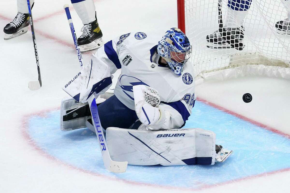 Andrei Vasilevskiy of the Lightning watches the puck go past him during the second period in Game 2 of the NHL Stanley Cup Finals against the Avalanche.
