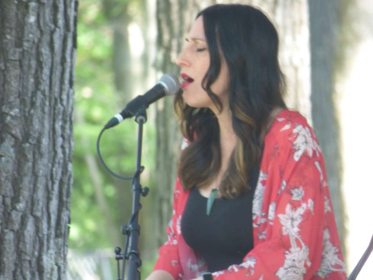 Moksha Sommer of the band HuDost sings on the main stage at the Spirit of the Woods Folk Festival held in Brethren Saturday.