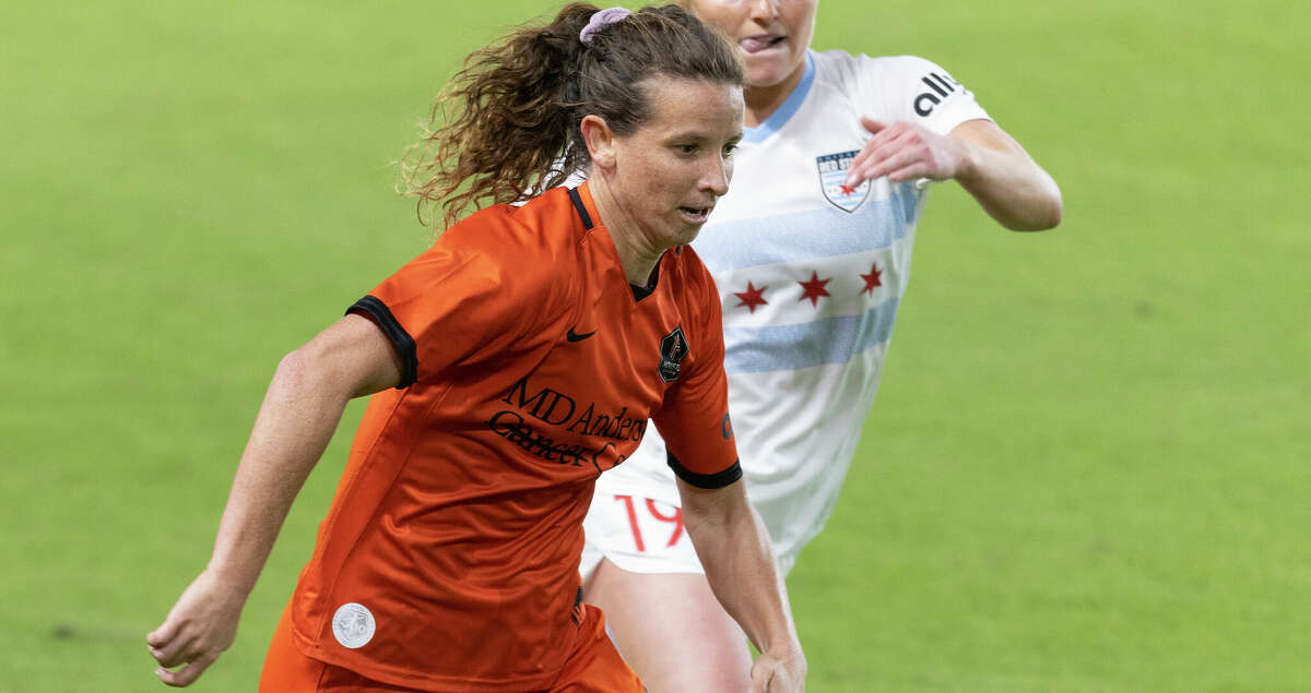 Houston Dash midfielder Elizabeth Eddy (19) dribbles against Chicago Red Stars defender Channing Foster (19) in the second half at PNC Stadium on March 20, 2022 in Houston. Chicago won 3 to 1.