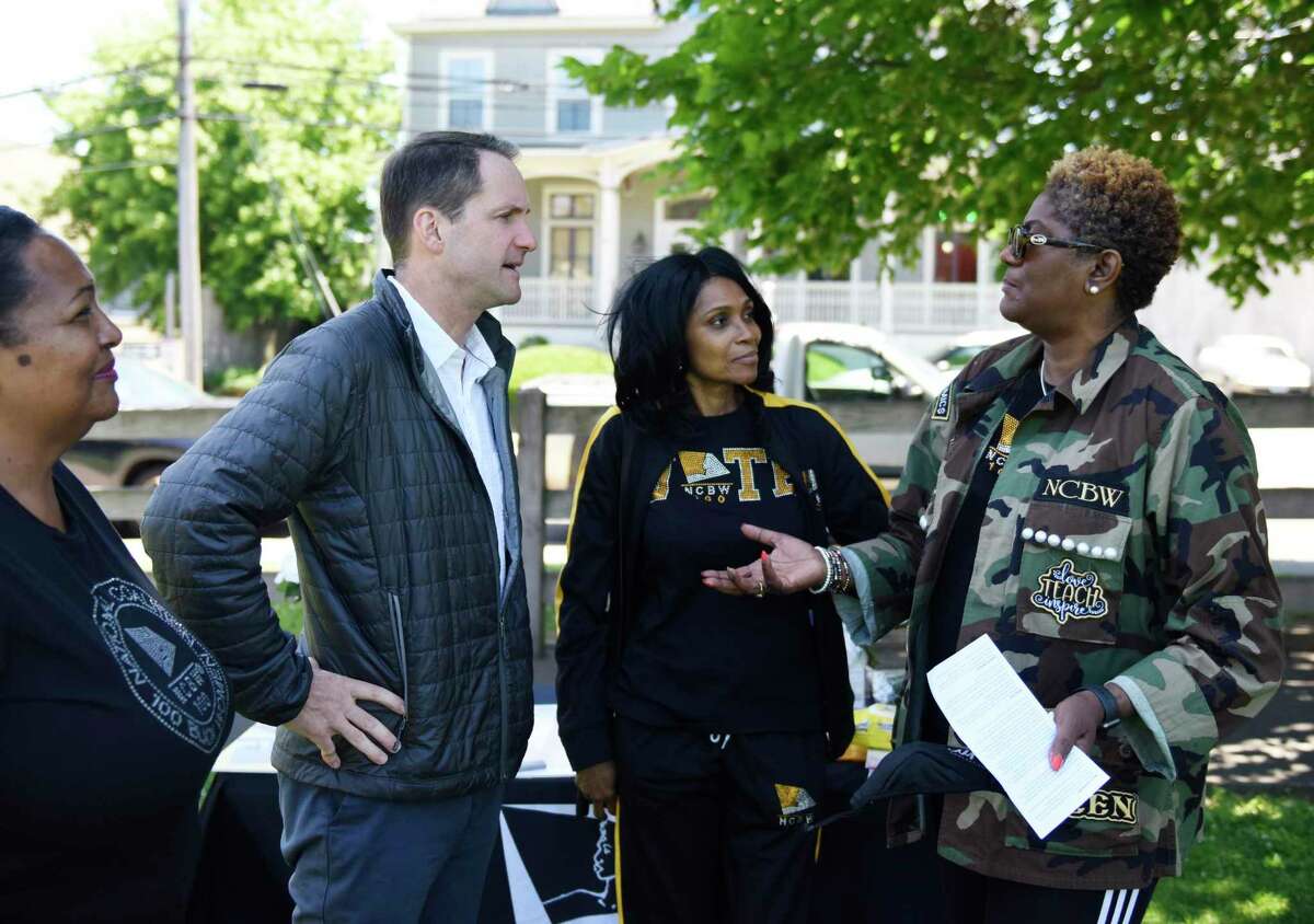 U.S. Rep. Jim Himes, D-4, speaks with, from left, National Coalition of 100 Black Women New Haven Chapter Public Policy Chair Carolyn Vermont, Second Vice President Lorraine Gibbons, and First Vice President Valenica Goodridge during the Juneteenth celebration in Stamford on Sunday. See more photos on page A7.