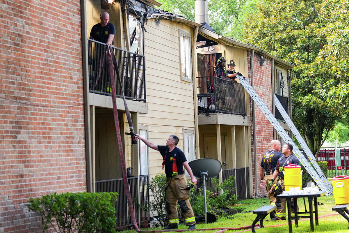 Houston firefighters work to stamp out an apartment fire in the 9900 block of Richmond Monday, June 20, 2022 in Houston. The fire was reported at about 8 a.m. Monday and heavily damaged an unspecified number of apartment units. One civilian was evaluated at the scene, but no one was transported to the hospital.