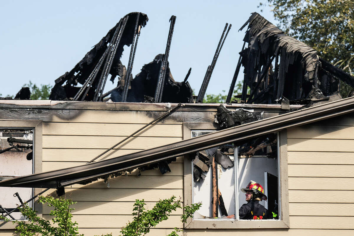 Houston firefighters work to stamp out an apartment fire in the 9900 block of Richmond Monday, June 20, 2022 in Houston. The fire was reported at about 8 a.m. Monday and heavily damaged an unspecified number of apartment units. One civilian was evaluated at the scene, but no one was transported to the hospital.