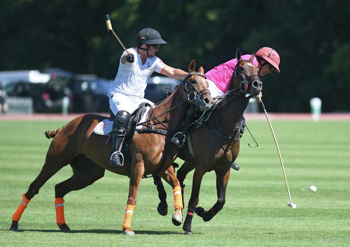 La Fe’s Agustin Palomeque, left, and Level Select CBD’s Joaquin Panelo battle for the ball in the East Coast Bronze Cup finals between Level Select CBD and La Fe at the Greenwich Polo Club on Sunday.