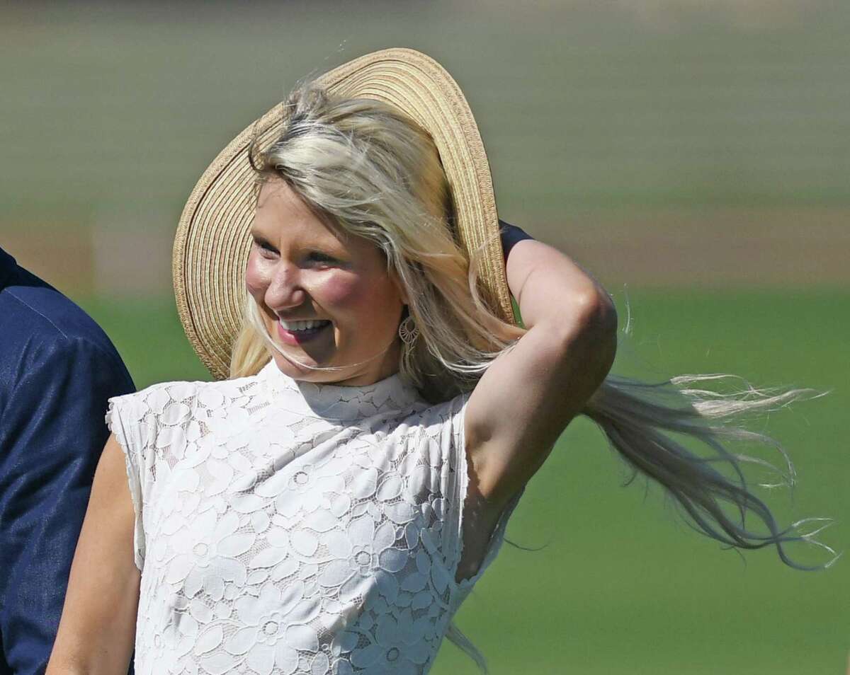 Jessica Simanow of East Hampton, New York loses her hat in a gust of wind during halftime of the East Coast Bronze Cup final between Level Select CBD and La Fe at the Greenwich Polo Club in Greenwich , Connecticut, Sunday, June 19, 2022.