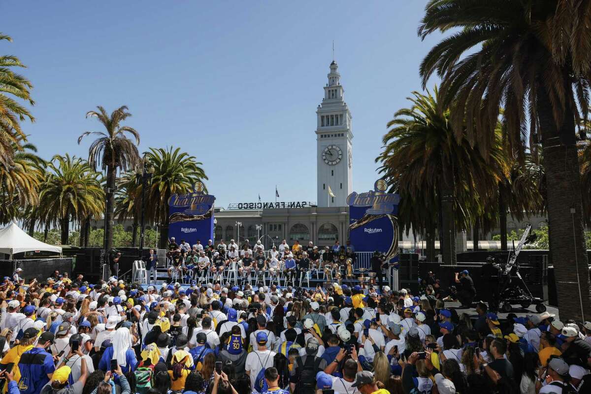 Fans watch during opening celebrations at the Warriors Championship parade in San Francisco, Calif., on Monday, June 20, 2022.