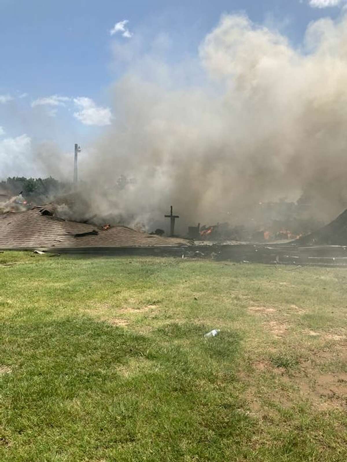 A fire destroyed the Balsora Baptist Church but when the smoke cleared, a cross was left standing.