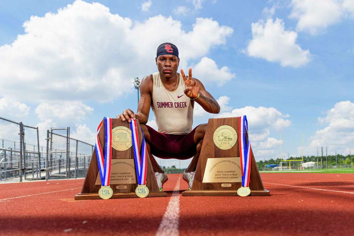 Darius Rainey poses with his UIL medals and 2021 & 2022 state championship trophies at Summer Creek High School on Sunday, June 05, 2022.