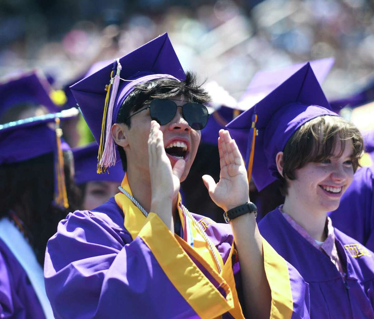 Graduating senior Austin Tovar claps during the Westhill High School 49th annual commencement at J. Walter Kennedy Stadium in Stamford on Monday.