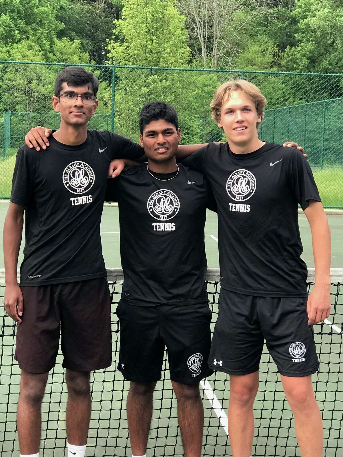 Section II singles champion Krishnadhev Jammula, center, surrounded by teammates and third-place doubles team Zain Magdon-Ismail and William Fraser.