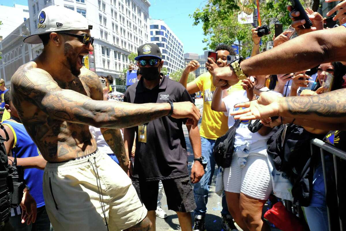 Gary Payton II greets fans during the Warriors championship parade following their NBA Finals win over the Boston Celtics on Market Street in San Francisco, Calif.  on Monday, Jun 20, 2022.