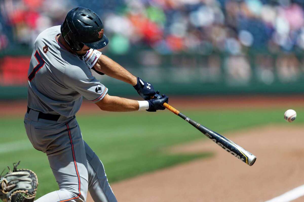 Auburn's Cole Foster (7) hits a three run double in the sixth inning against Stanford during an NCAA College World Series baseball game, Monday, June 20, 2022, in Omaha, Neb. (AP Photo/John Peterson)