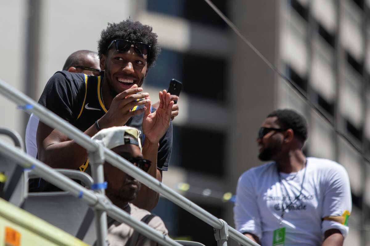 Center James Wiseman claps during the Golden State Warriors Championship parade on Market Street in San Francisco, Calif. on June 20, 2022.