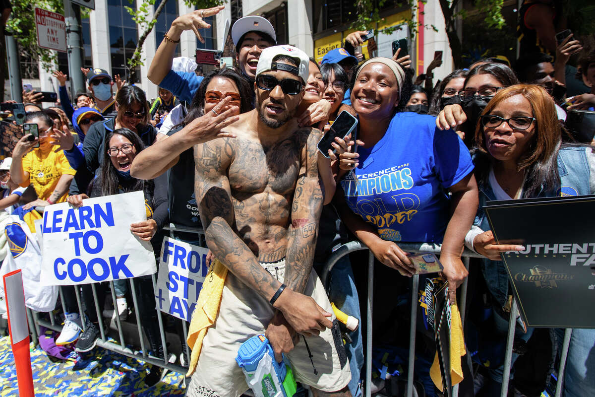 Forward Gary Payton II poses with fans during the Golden State Warriors Championship Parade on Market Street in San Francisco, California.  On June 20, 2022.