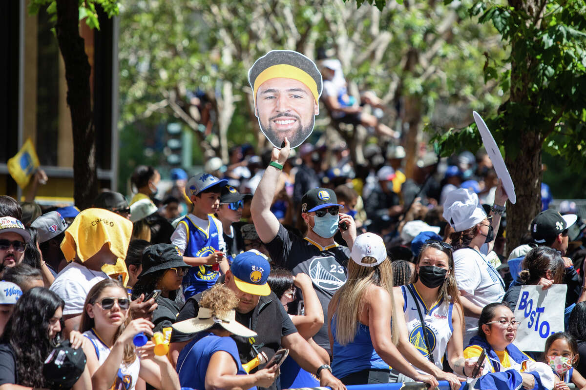 A fan holds a Kay Thompson head cutout during the Golden State Warriors Championship parade on Market Street in San Francisco, Calif.  on June 20, 2022.