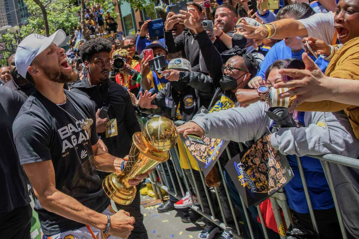 Stephen Curry celebrates at the Championship Parade along Market Street, Monday, June 20, 2022, in San Francisco, Calif. The Warriors are the 2022 NBA champions after beating the Boston Celtics in Game 6 of the NBA Finals.