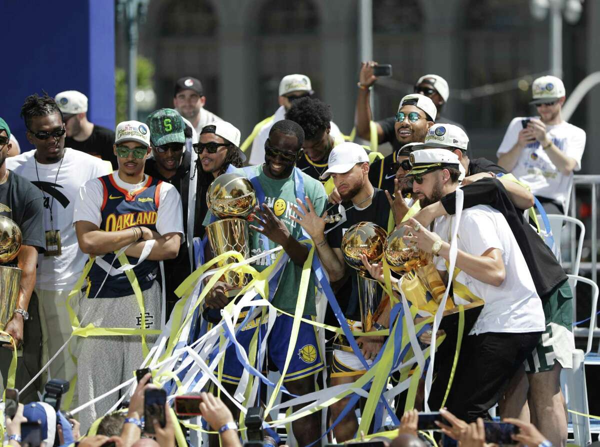 The Golden State Warriors celebrate their NBA victory during Monday’s parade in San Francisco.