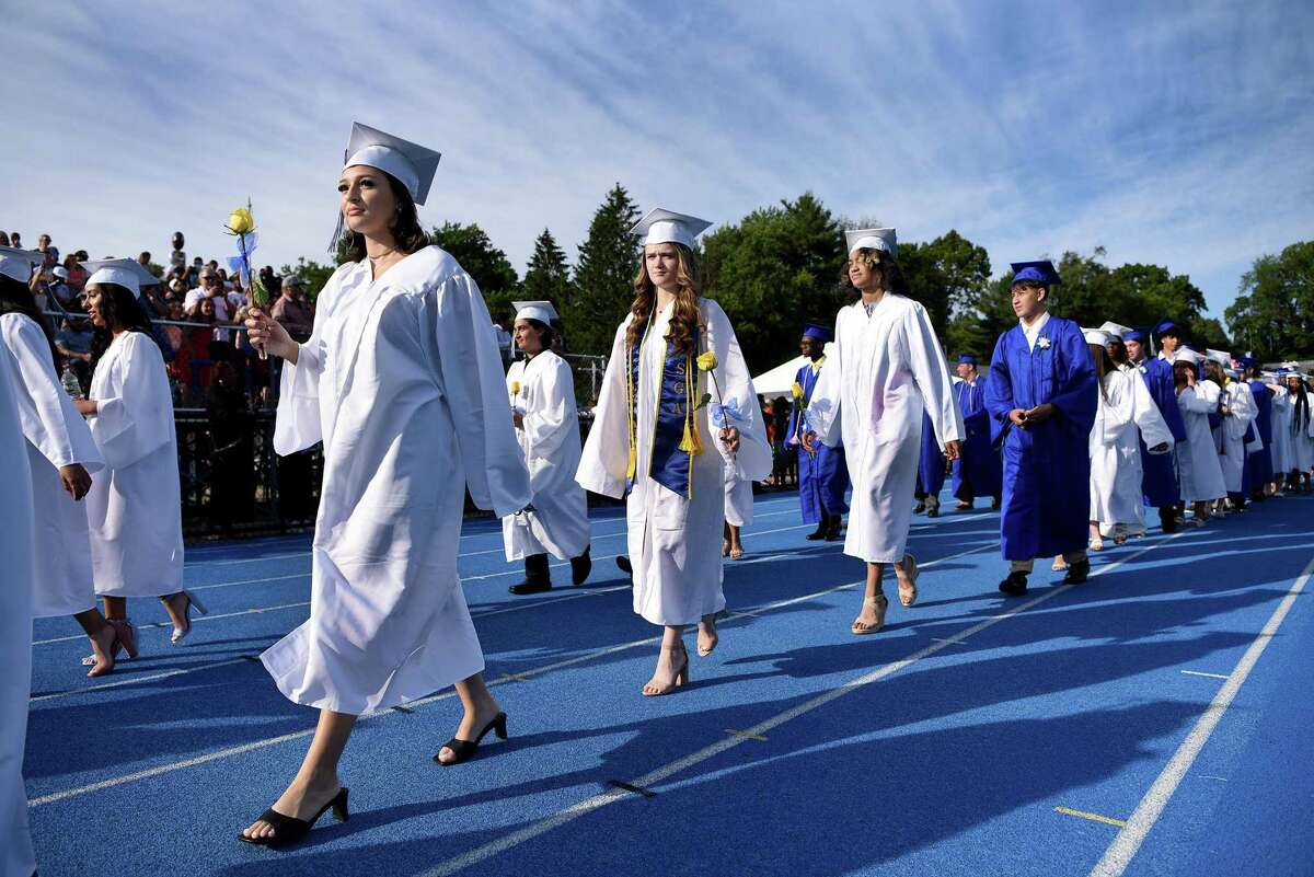 Graduates enter the field at the start of graduation ceremonies at Bunnell High School in Stratford Monday, June 20, 2022.