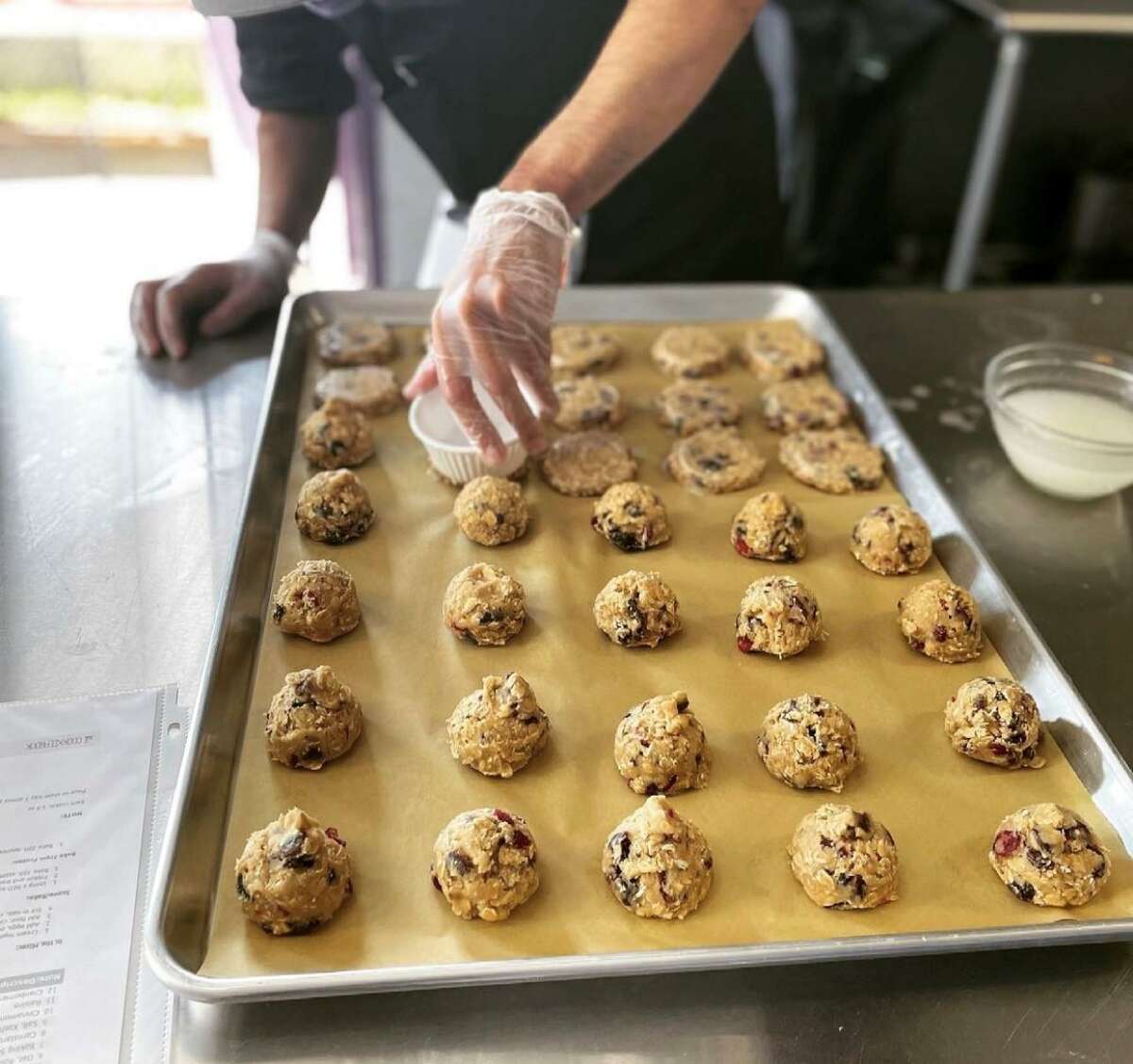 An employee of Sweet P Bakery in Westport makes cookies.