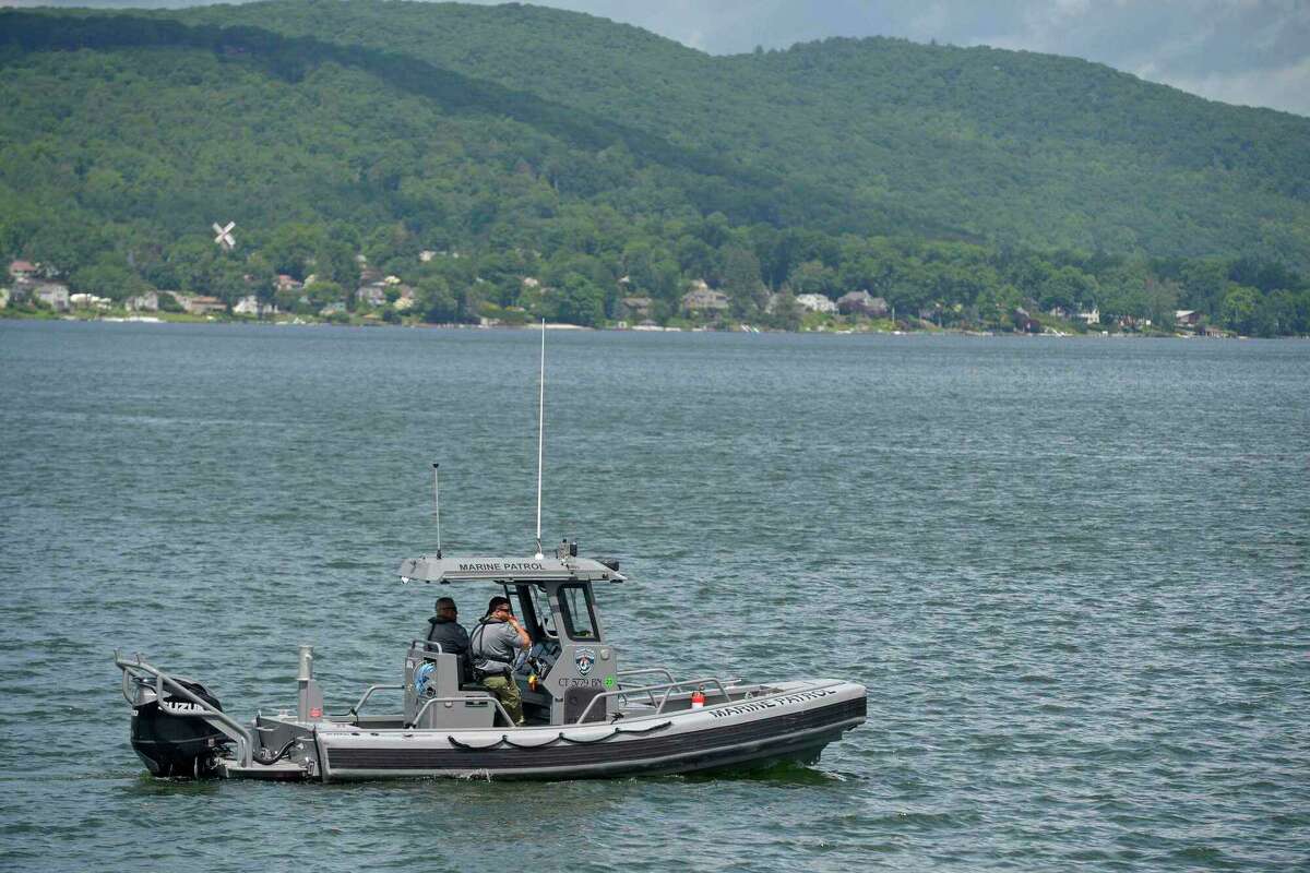 A patrol boat searches Candlewood Lake for the body of a man who went missing in a suspected drowning on Memorial Day weekend. The man’s remains were located June 16, and police identified him Tuesday as 24-year-old Larry Kwokpo Chan, of Bristol.