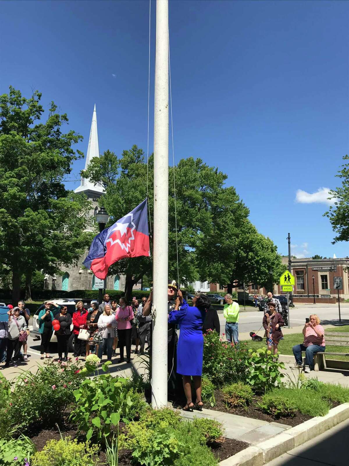 Torrington honored resident Darlene Battle as its 2022 Juneteenth Mayor, with a ceremony on June 19 outside City Hall. Battle and Torrington Police Chief William Baldwin raise the Juneteenth flag during the ceremony.