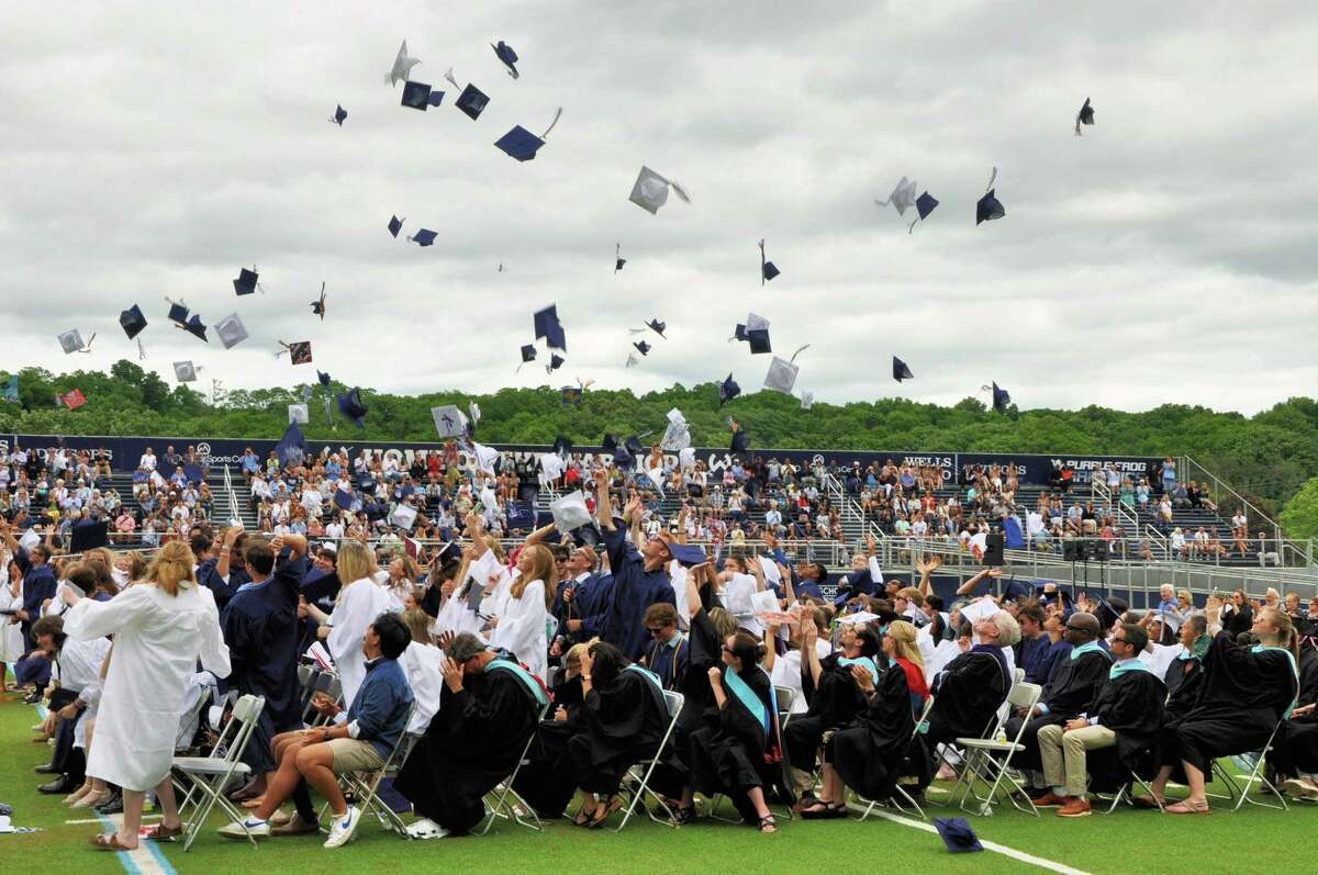 Wilton High School Class of 2022 graduates toss their caps into the sky just before they walk off the field and into a next chapter that will be all their own to explore.