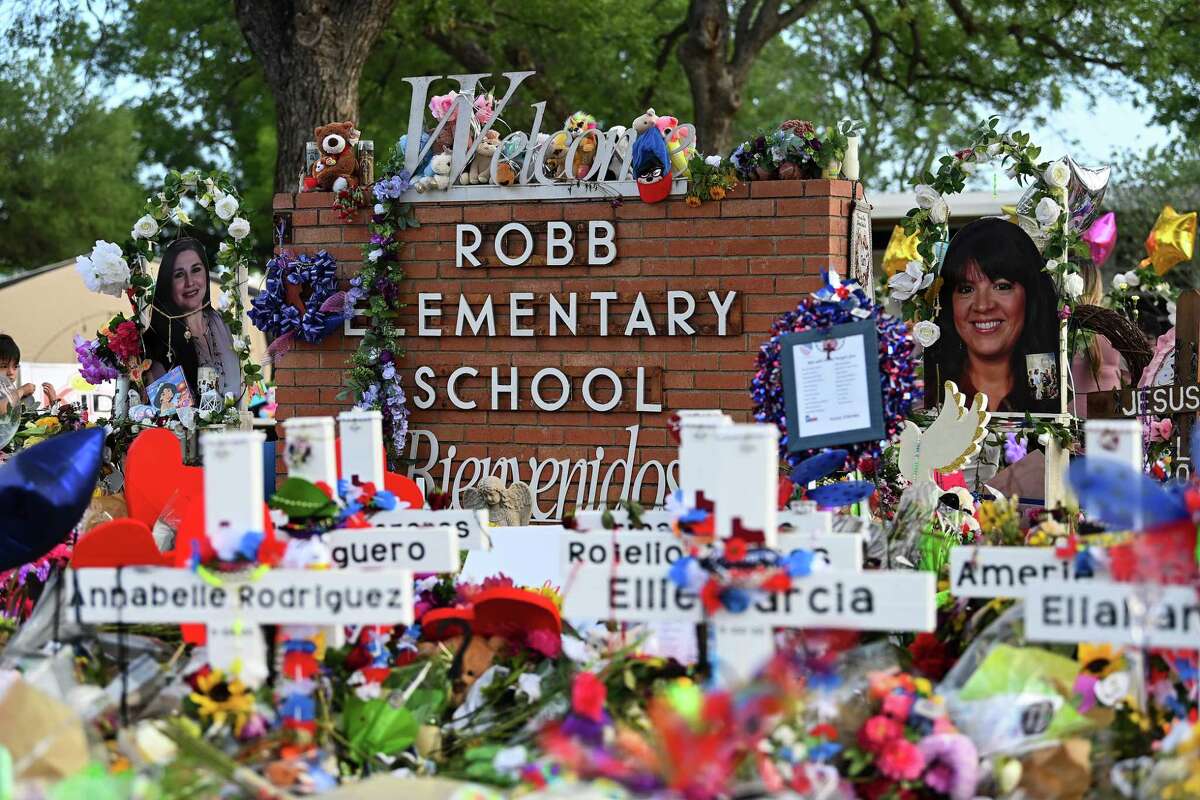 Flowers, balloons, toys and other items are seen May 31 at a memorial for the students and teachers killed in the Robb Elementary School shooting in Uvalde, Texas.