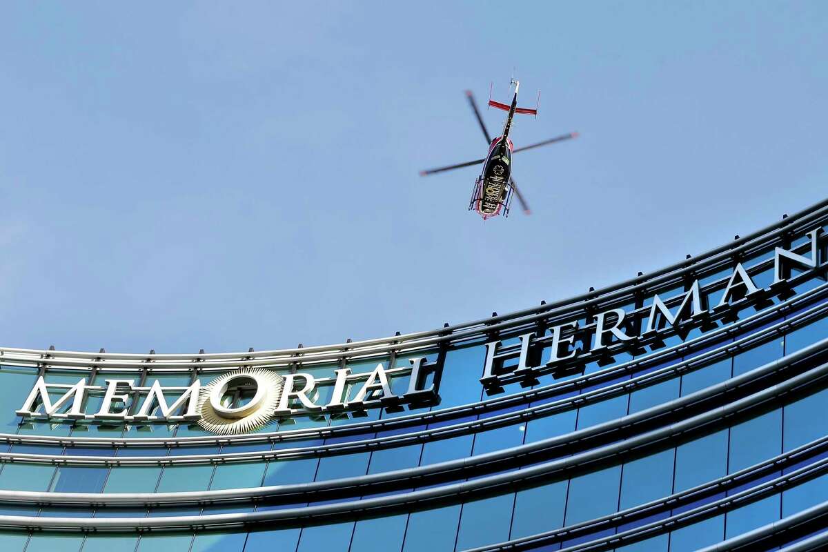 A medical helicopter approaches the roof to land on a Memorial Hermann Hospital building along Fannin St. in the Texas Medical Center district Thursday, July. 23, 2020 in Houston, TX.